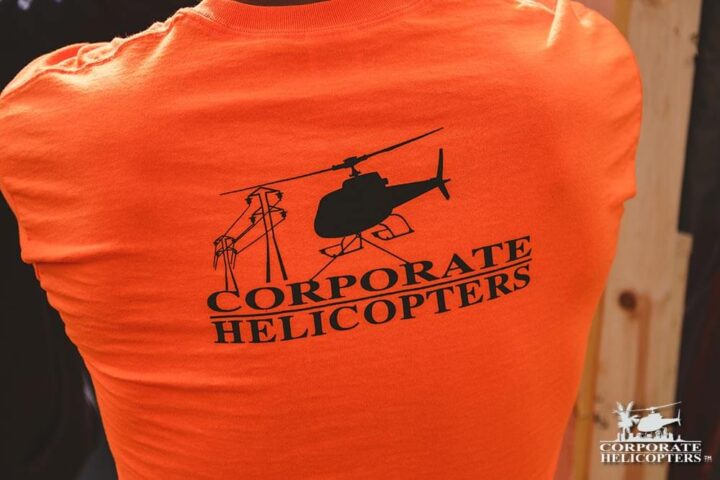 An orange Corporate Helicopters utility t-shirt