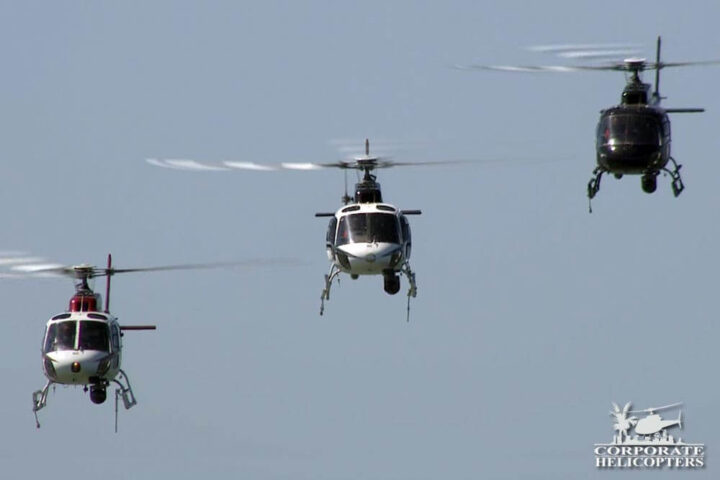 Three helicopters flying in formation