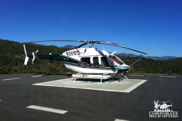 2000 Bell 207 helicopter on a helipad