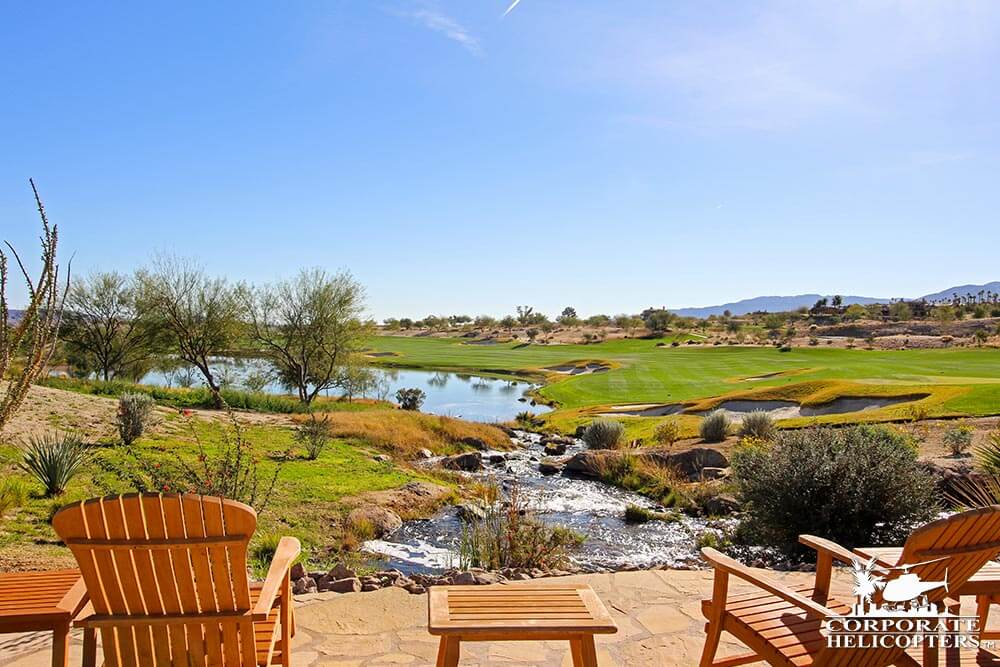 Chairs and a table overlook at beautiful golf course