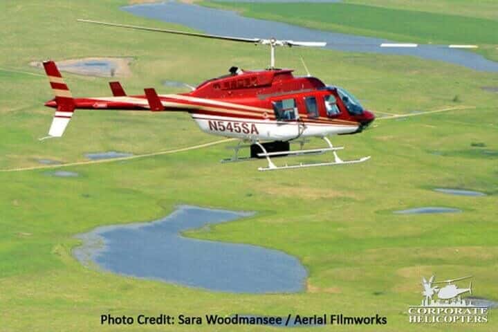 A LiDAR-equipped helicopter in flight. Photo Credit: Sara Woodmansee / Aerial Filmworks