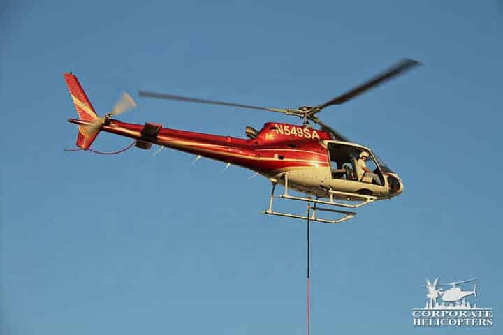 Helicopter with an aerial crane line attached