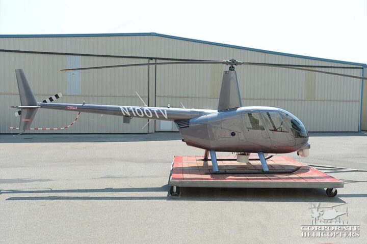 Side view of 2012 Robinson R44 Raven II Newscopter