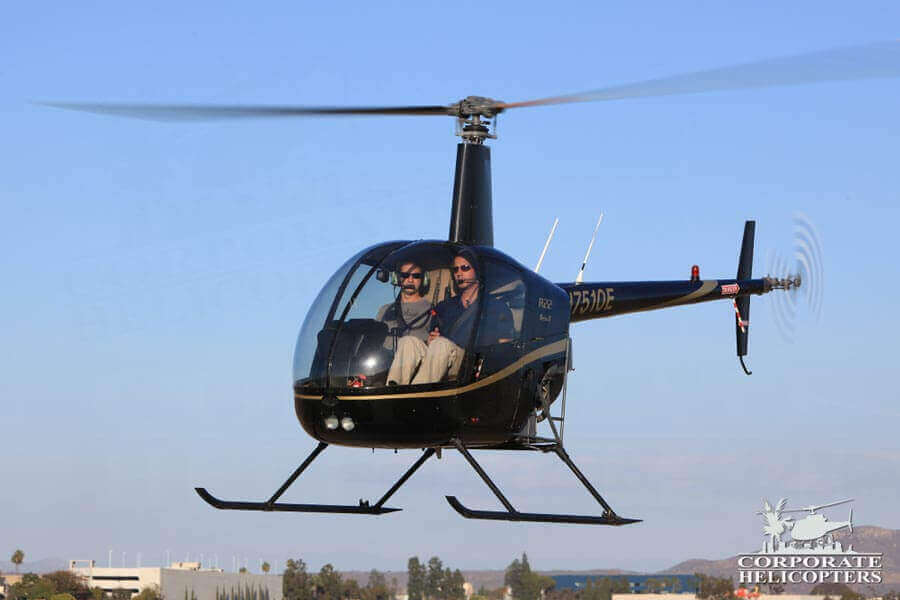 A helicopter with 2 passengers hovers
