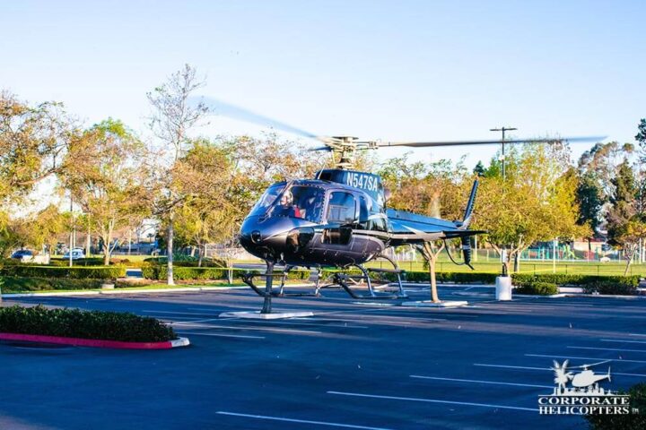 Helicopter hovers in parking lot at Las Americas Mall