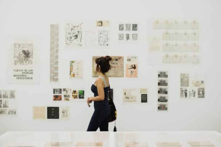 Woman looking at art on a museum wall